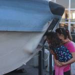 Jennifer Zovar peeks into float space of the seaplane with her daughter Helen. They visited Veterans Day weekend from Bellingham.                                Photo by Patricia Guthrie/Whidbey News-Times