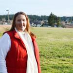 County Commissioner Jill Johnson stands in front of the property that Island County is in the process of purchasing for a crisis center and affordable housing complex. The seven-acre parcel is located in Oak Harbor and would serve Island, Skagit and San Juan counties. Photo by Laura Guido/Whidbey News-Times