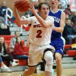 Ethan Spark (2) attacks the hoop Friday. Spark, however, did most of his damage from the outside, sinking five three-pointers.(Photo by John Fisken)