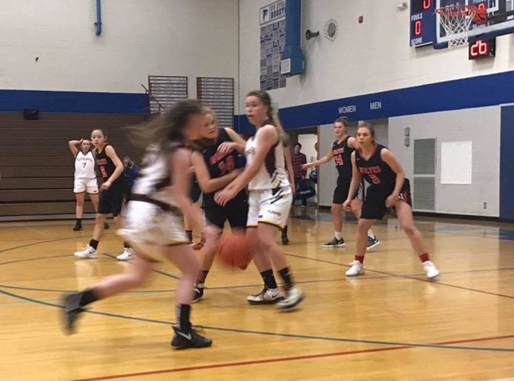 Coupeville (black jerseys) plays defense in Saturdays game. (Submitted photo)