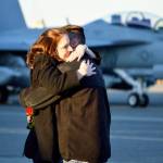 A couple embraces during the homecoming for Electronic Attack Squadron 142 Tuesday. The Gray Wolves were deployed for six months. Photo by Laura Guido/Whidbey News-Times