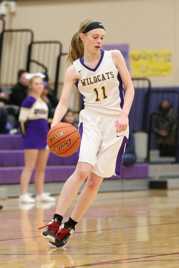 Olivia Waite handles the point for Oak Harbor.(Photo by John Fisken)