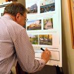 John Mishasek, a Port of Coupeville commissioner, writes in a comment on the recommendations put forth by the North Whidbey Affordable Housing Task Force. The open house Thursday night provided an opportunity for the pubic to ask questions, submit comments and answer questionnaires about the task forces ideas. Photo by Laura Guido/Whidbey News-Times