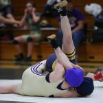 Oak Harbors Elizabeth Clairmont records her second fall of the night by pinning Burlington-Edisons Isabel Banta. (Photo by John Fisken)