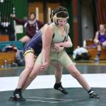 Taylor Cress tries to escape from Burlington-Edisons Abgayle Sims.(Photo by John Fisken)