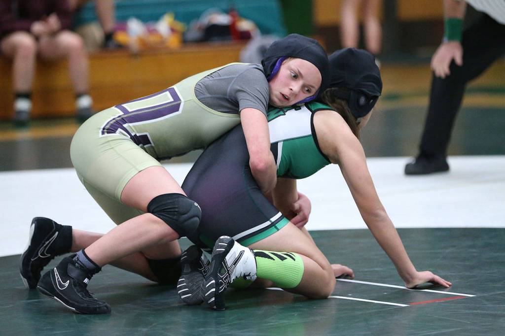 Ella Erikson, top, begins the third period against Mount Vernons Lizzy Partida.(Photo by John Fisken)