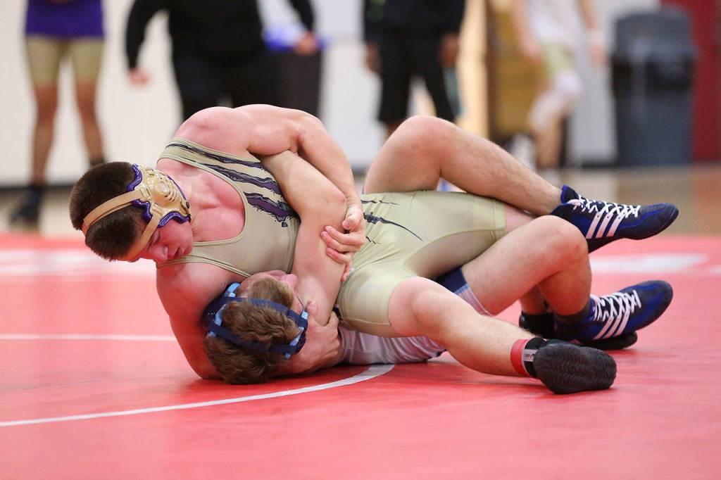 Dylan Sanchez pins Meadowdales Devin Deweese in the first round.(Photo by John Fisken)