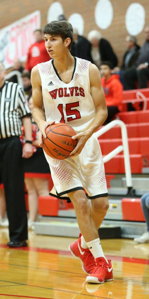 Joey Lippo prepares to pass against Sequim.(Photo by John Fisken)