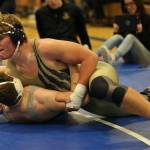 Michael Fisken puts his opponent on his back on the way to winning the third place match Saturday. (Photo by John Fisken)