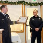Photo by Jessie Stensland / Whidbey News-Times                                Oak Harbor Police Chief Kevin Dresker presents Officer Michael Brown with the departments Medal of Distinction.