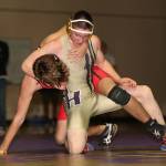 Oak Harbors Chris Brooks, front, tangles with Snohomishs Christian Simonson. (Photo by John Fisken)