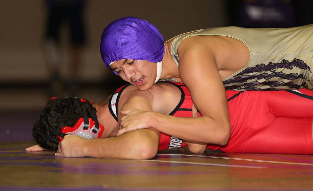 Oak Harbors Giovanni Ribay, top, takes control in his match with Humoody Smith, who is blind. (Photo by John Fisken)