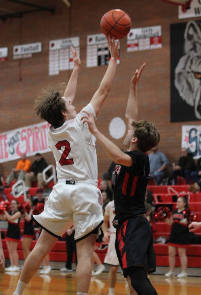 Ethan Spark attacks the rim for the Wolves.(Photo by Jim Waller/Whidbey News-Times)