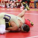 Oak Harbors Aaron Fletcher, left, pins PJ Galindo.(Photo by John Fisken)