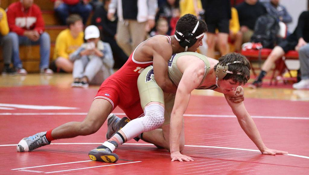 Blake McBride, right, begins to escape from Marysville-Pilchucks Isaiah Galindo.(Photo by John Fisken)