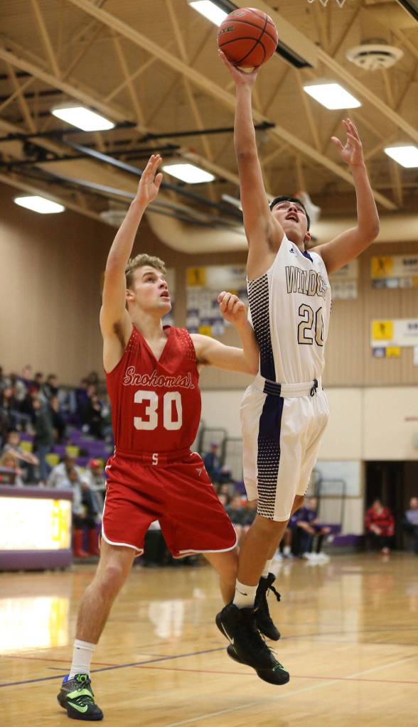 Weston Whitefoot powers through Snohomishs Carter Sparks for two points. (Photo by John Fisken)