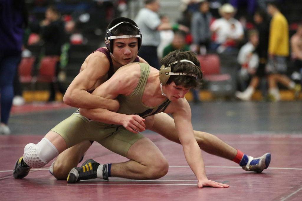 Oak Harbors Blake McBride, front, works to free himself from ODeas Nate Balinbin. McBride went on to pin Balinbin to claim third place.(Photo by John Fisken)