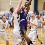 Oak Harbors Terrell Crumpton soars toward the hoop Monday night.(Photo by John Fisken)