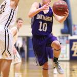 Gabe Salinger jumps past Burlington-Edisons Jackson Reisner.(Photo by John Fisken)