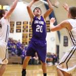 Oak Harbors Weston Whitefoot puts up a jumper Monday at Burlington-Edison.(Photo by John Fisken)
