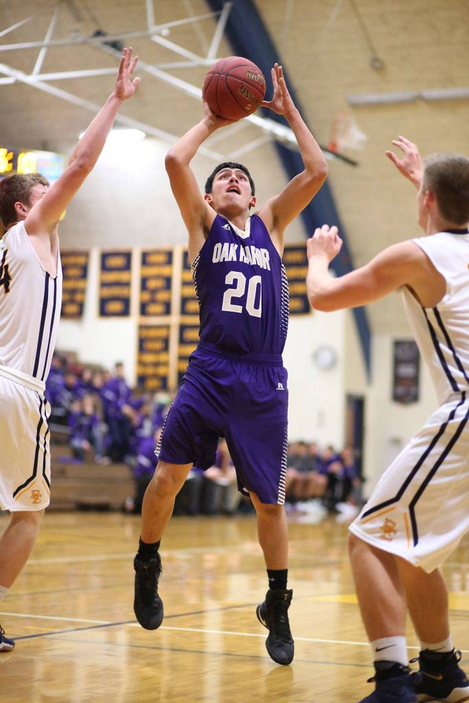 Oak Harbors Weston Whitefoot puts up a jumper Monday at Burlington-Edison.(Photo by John Fisken)