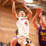 Smith times two. Hunter Smith (above) and sibling Scout (below) take the ball to the rim for the Wolves.(Photos by John Fisken)