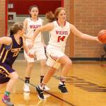 Coupevilles Ema Smith (14) races by Concretes Madisyn Renzelman (13) as Scout Smith looks on.(Photo by John Fisken)