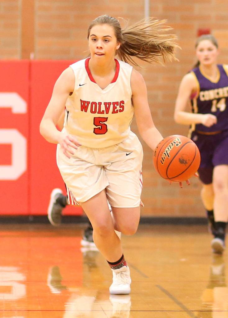 Coupevilles Kyla Briscoe takes off on a fast break in the win over Concrete. (Photo by John Fisken)
