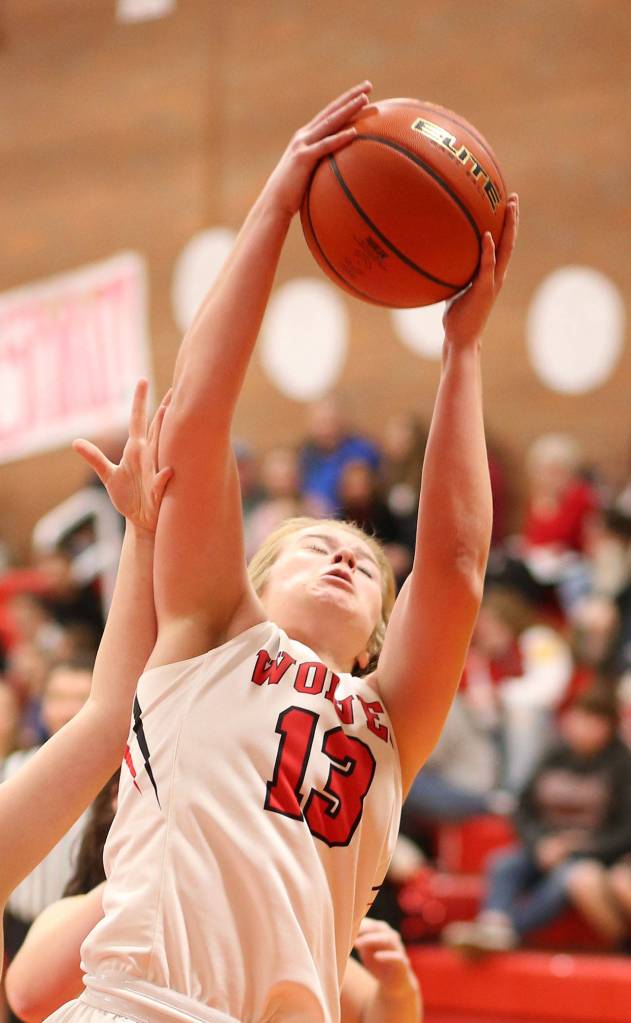 Hannah Davidson hauls in a rebound for Coupeville.(Photo by John Fisken)
