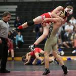 The Wildcats Dylan Sanchez, right, gets ready to throw his opponent in the Bellingham match.(Photo by John Fisken)