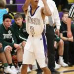 Terrell Crumpton puts up a three-point shot for Oak Harbor. (Photo by John Fisken)