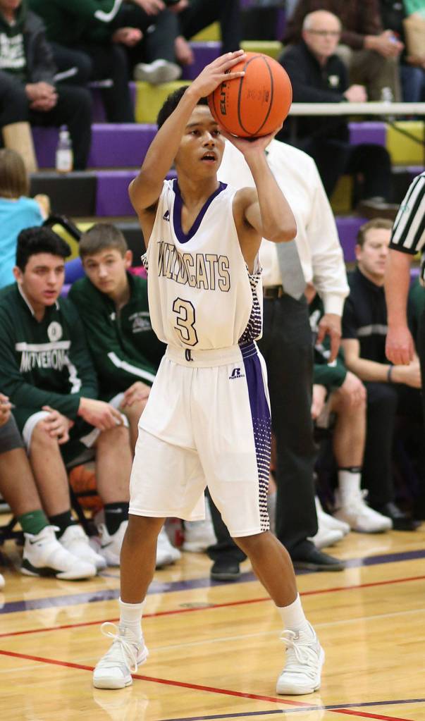 Terrell Crumpton puts up a three-point shot for Oak Harbor. (Photo by John Fisken)