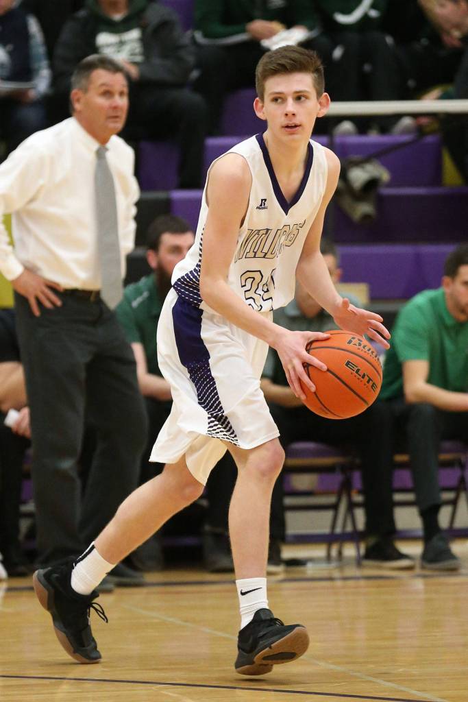 Kevin Schuldt looks for an open teammate against Mount Vernon Wednesday.(Photo by John Fisken)