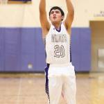Weston Whitefoot fires a jump shot for the Wildcats.(Photo by John Fisken)
