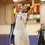 Jasmine Ford powers up for two points.(Photo by John Fisken)