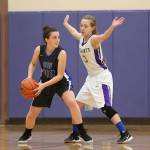 Oak Harbors Miranda Wilson, right, harasses South Whidbeys Karyna Hezel. Wilson and the Wildcat defense hounded the Falcons all night in Oak Harbors 44-33 win.(Photo by John Fisken)