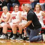 Coach David King instructs the Wolves from the sideline. On the bench are Avalon Renninger, left, Sarah Wright, Lindsey Roberts and Ema Smith.(Photo by John Fisken)