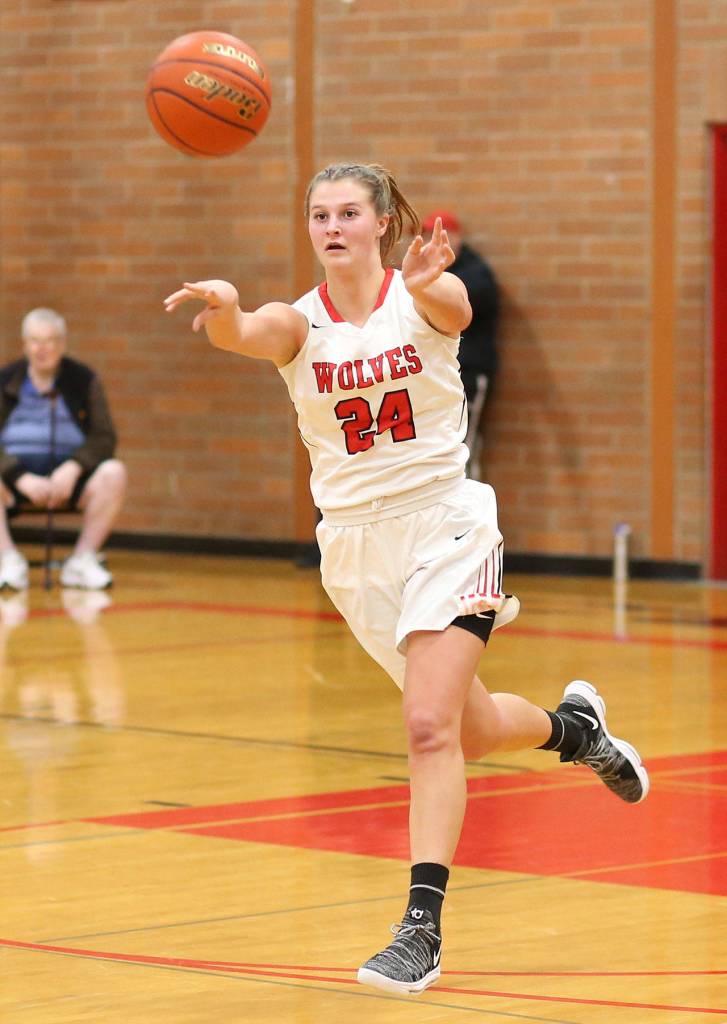 Lindsey Roberts passes ahead during a Coupeville fast break.(Photo by John Fisken)