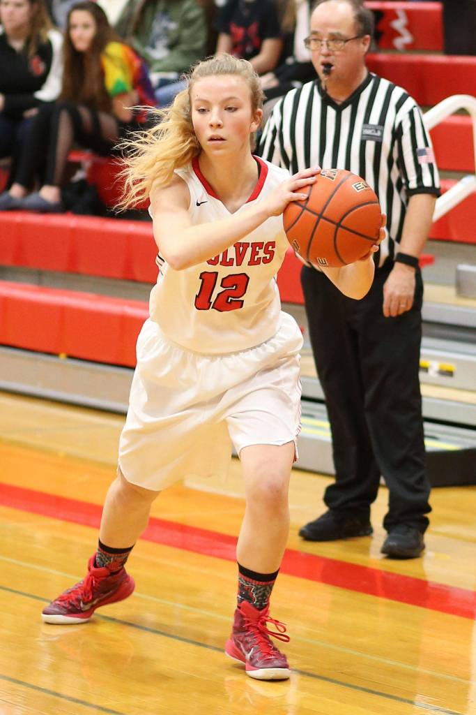 Allison Wenzel feeds the post against Orcas Island.(Photo by John Fisken)