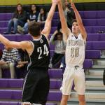 Gabe Salinger launches a shot over Meridians TJ Dykstra.(Photo by John Fisken)