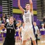 Oak Harbors Kevin Schuldt slips by Meridians Bailey Hodge for a hoop Friday.(Photo by John Fisken)