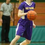 Olivia Waite brings the ball up the floor for Oak Harbor.(Photo by John Fisken)