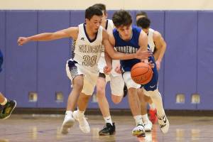 Buzzer-beater helps Wildcats ring in the new year / Boys basketball