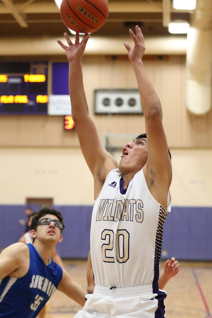 Weston Whitefoot puts up a shot after grabbing an offensive rebound.(Photo by John Fisken)