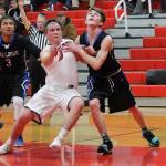 Hunter Downes, left, fights North Masons Ryan Pearson for rebounding postion on a free throw. (Photo by Jim Waller/Whidbey News-Times)