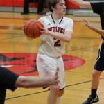 Ethan Spark looks through a sea of North Mason hands for a passing lane.(Photo by Jim Waller/Whidbey News-Times)