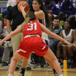 Jordan Wood-Pima, guarded by Stanwoods Madison Chisman, looks for an open teammate.(Photo by Jim Waller/Whidbey News-Times)