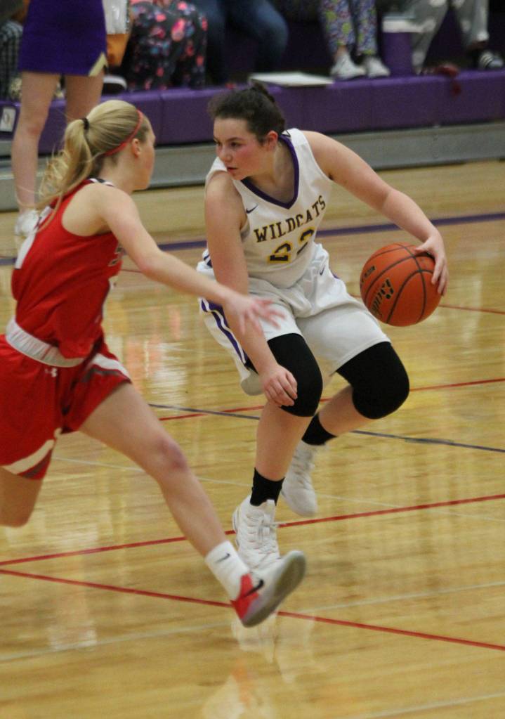 Oak Harbors Mia Littlejohn tries to shake a Stanwood defender.(Photo by Jim Waller/Whidbey News-Times)