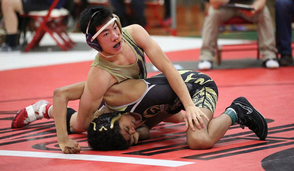Jakob Dailey, top, tangles with Lynnwoods Josiah Powell at the Panther Class. Dailey won the match with a second-round fall. (Photo by John Fisken)