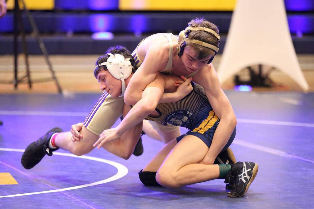 Nicholas Morris, top, tries to control his Everett opponent Friday.(Photo by John Fisken)